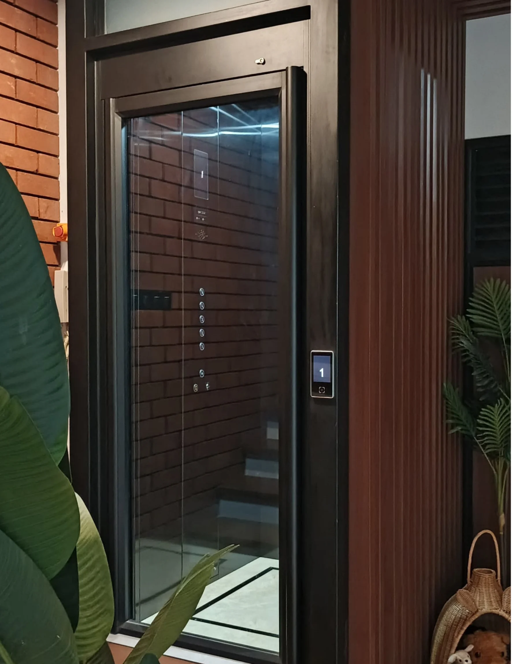 Tenkai V300 home lift with a glazed door and touch panel at Nivara Kemang Townhouse, Jakarta